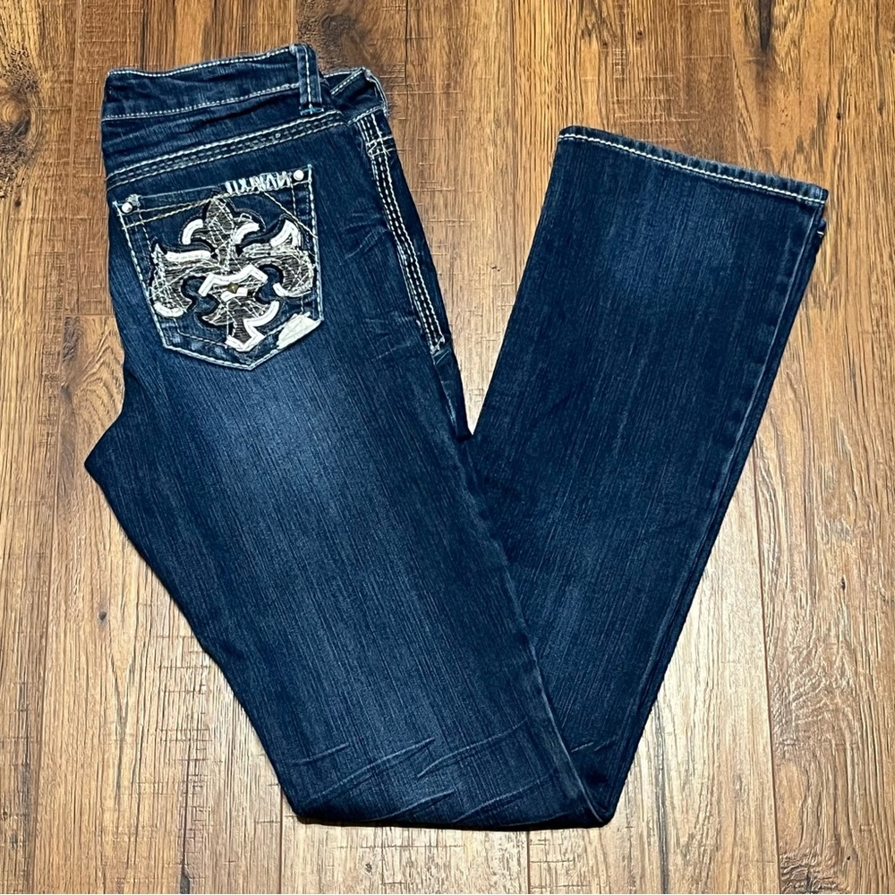 Woman’s Blue Boot Cut Jeans with Embellished Design